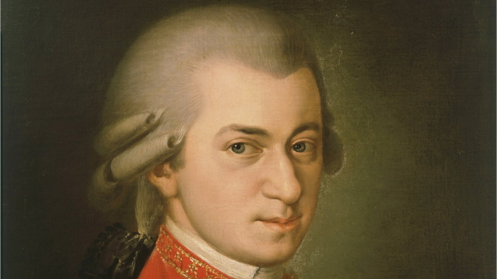 Barbara Krafft's 1819 portrait of Wolfgang Amadeus Mozart: a young man with powdered hair in a red coat with gold embroidery