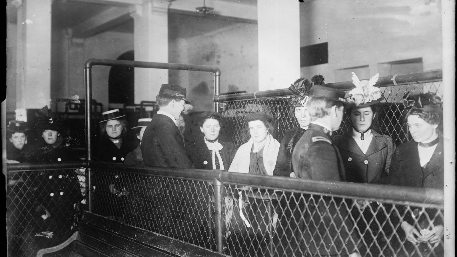Immigrants waiting their turn in a holding pen at Ellis Island